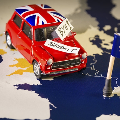 red-vintage-car-with-union-jack-flag-and-brexit-or-bye-words-over-an-ue-map-and-flag.jpg